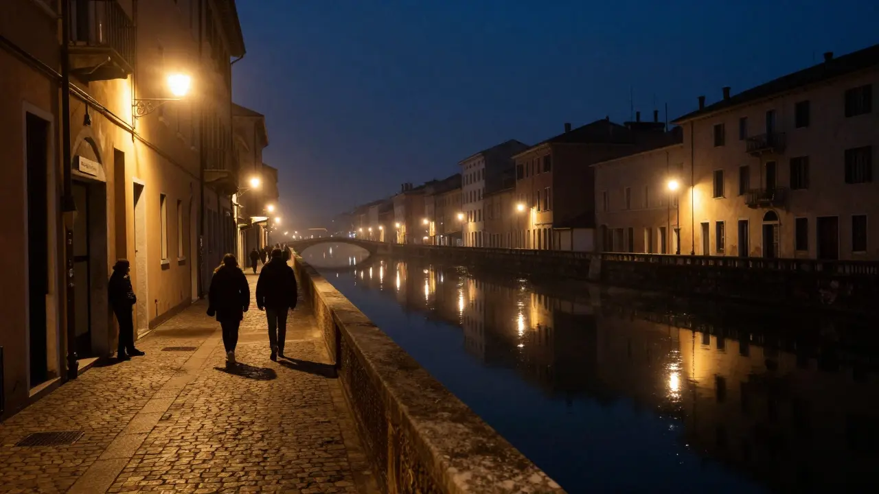 Night scene of Milan's Navigli canal with soft lights and a hidden entrance.